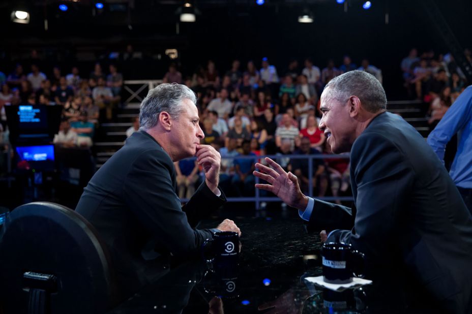 Stewart talks with President Barack Obama between segments of "The Daily Show" in 2015.