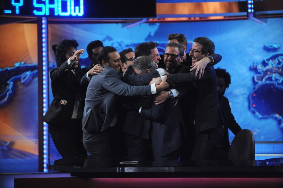 Stewart and other members of "The Daily Show" share a group hug after his last episode in 2015.