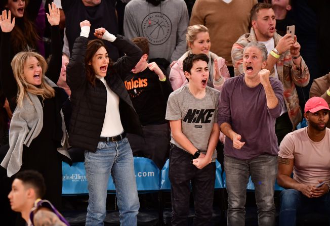 Stewart and his son, Nathan, cheer during a New York Knicks basketball game in 2019. Next to Nathan is actress Emmy Rossum.