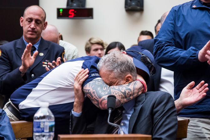 FealGood Foundation co-founder John Feal hugs Stewart during a House Judiciary Committee hearing in 2019. <a href="https://www.cnn.com/2019/06/11/politics/jon-stewart-9-11-crying/index.html" target="_blank">Stewart delivered an emotional statement</a> in favor of the reauthorization of the September 11th Victim Compensation Fund. The fund provides financial assistance to responders, victims and their families who require medical care related to health issues they suffered in the aftermath of 9/11 terrorist attacks. Stewart also gave a blistering condemnation of the apparent lack of attendance by House members.