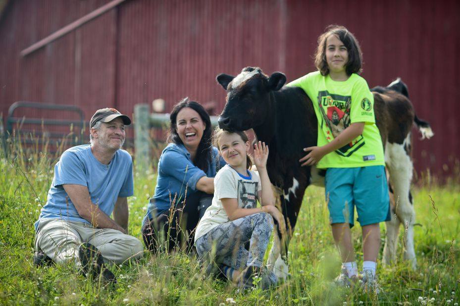Stewart and his family pose with a rescued calf named Valentino at a farm sanctuary in New York in 2015. Stewart and his wife, Tracey, are both vegans.