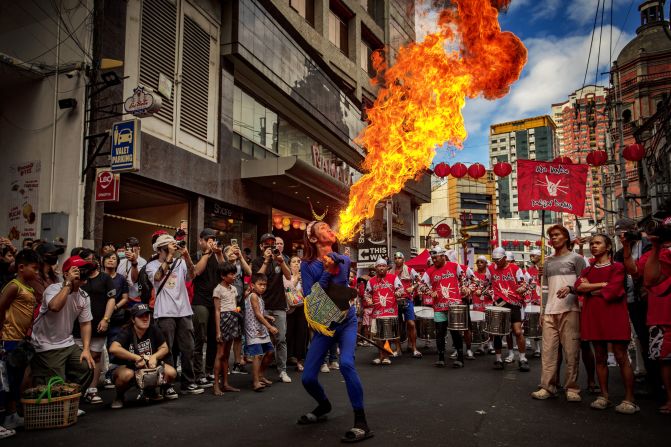 A performer breathes fire during Lunar New Year celebrations at Binondo district, considered the world's oldest Chinatown, on February 10, in Manila, Philippines.