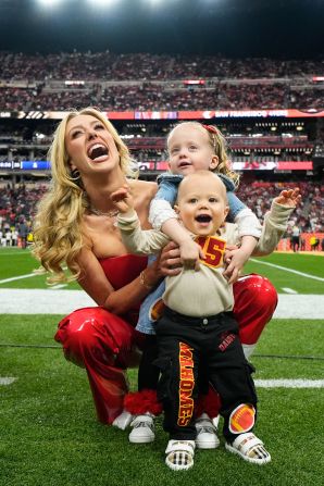 Mahomes' wife, Brittany, poses for a photo with their children, Sterling and Bronze, before the game.