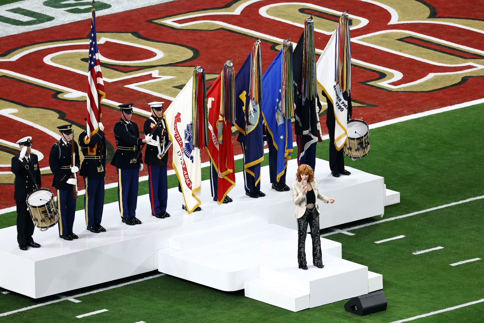 McEntire sings the national anthem.