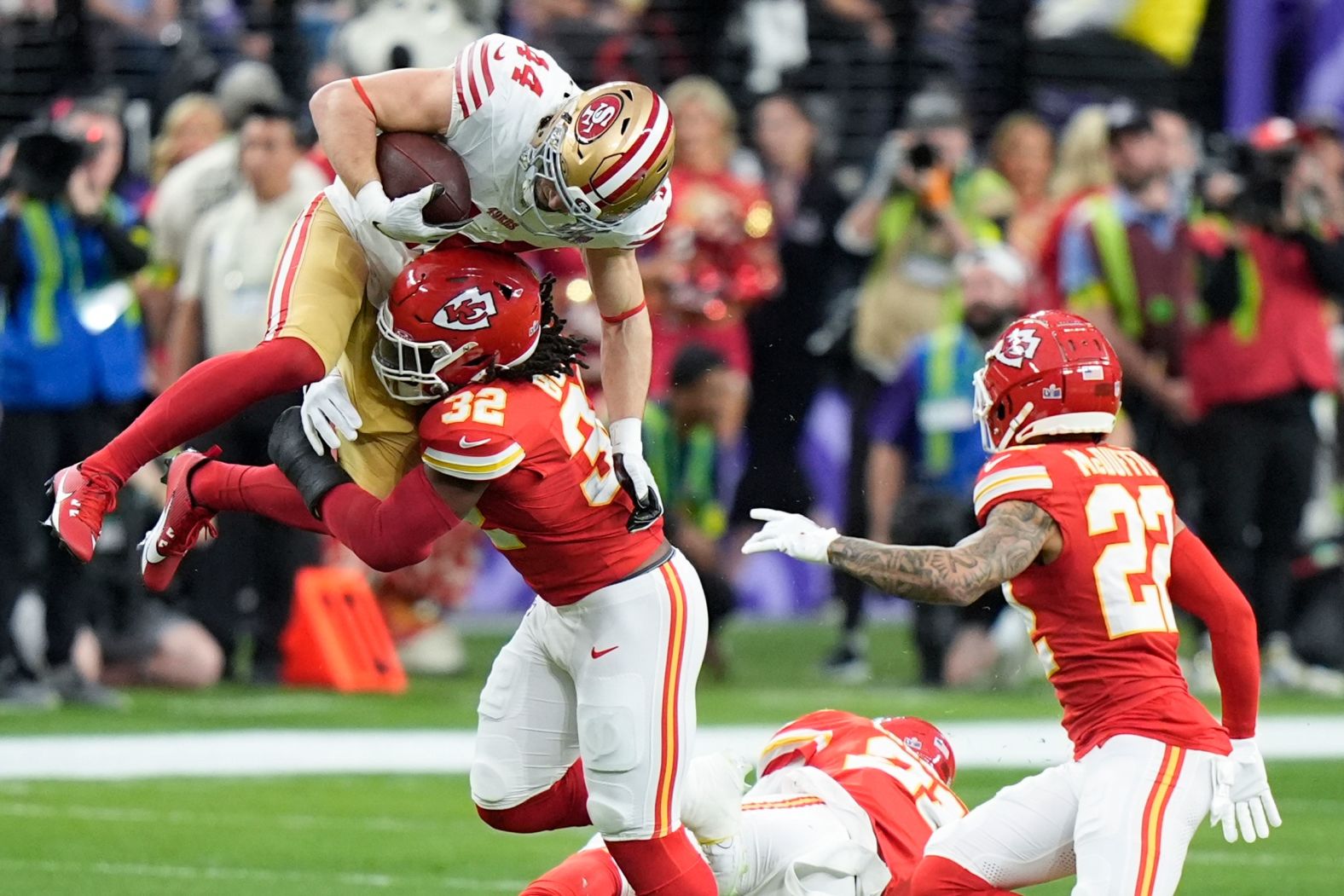 Chiefs linebacker Nick Bolton hits 49ers fullback Kyle Juszczyk on an early play.