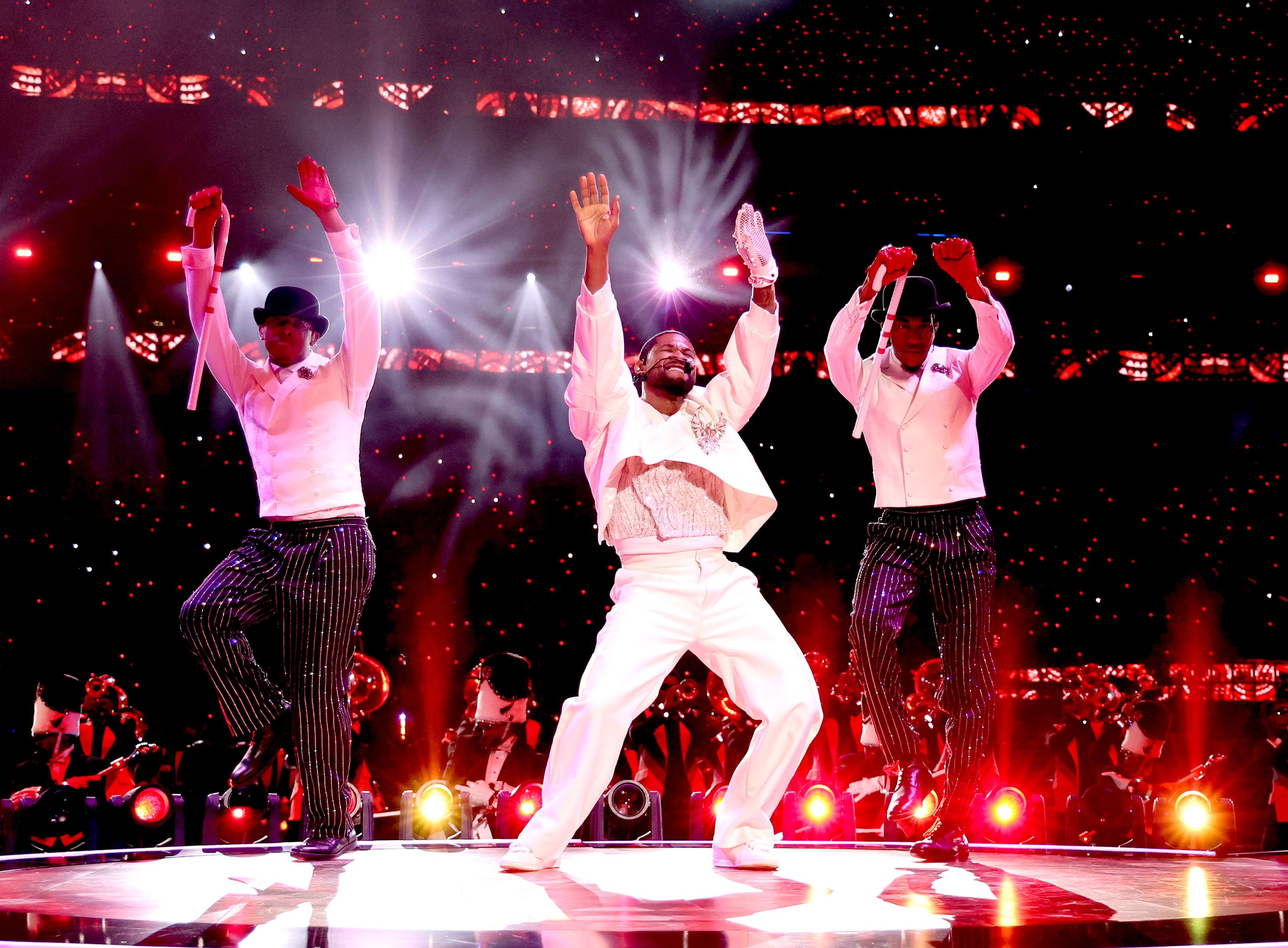 Usher performs with backup dancers during the Super Bowl LVIII halftime show on Sunday, February 11.