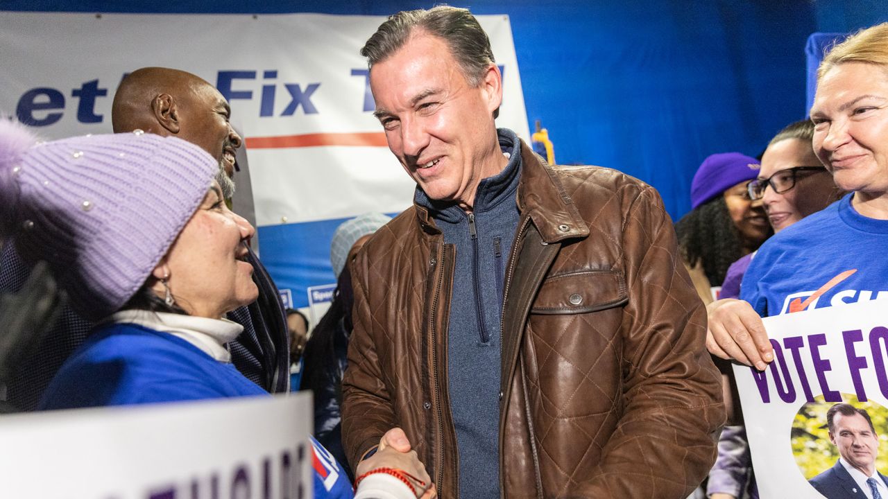 Tom Suozzi, US Democratic House candidate for New York, center, greets an attendee during the Westbury Canvass Launch in Westbury, New York, US, on Tuesday, Feb. 13, 2024. The election for New York's third Congressional district on Tuesday, which polls show is a toss-up, has morphed into a referendum on immigration, Israel and abortion. Photographer: Jeenah Moon/Bloomberg via Getty Images