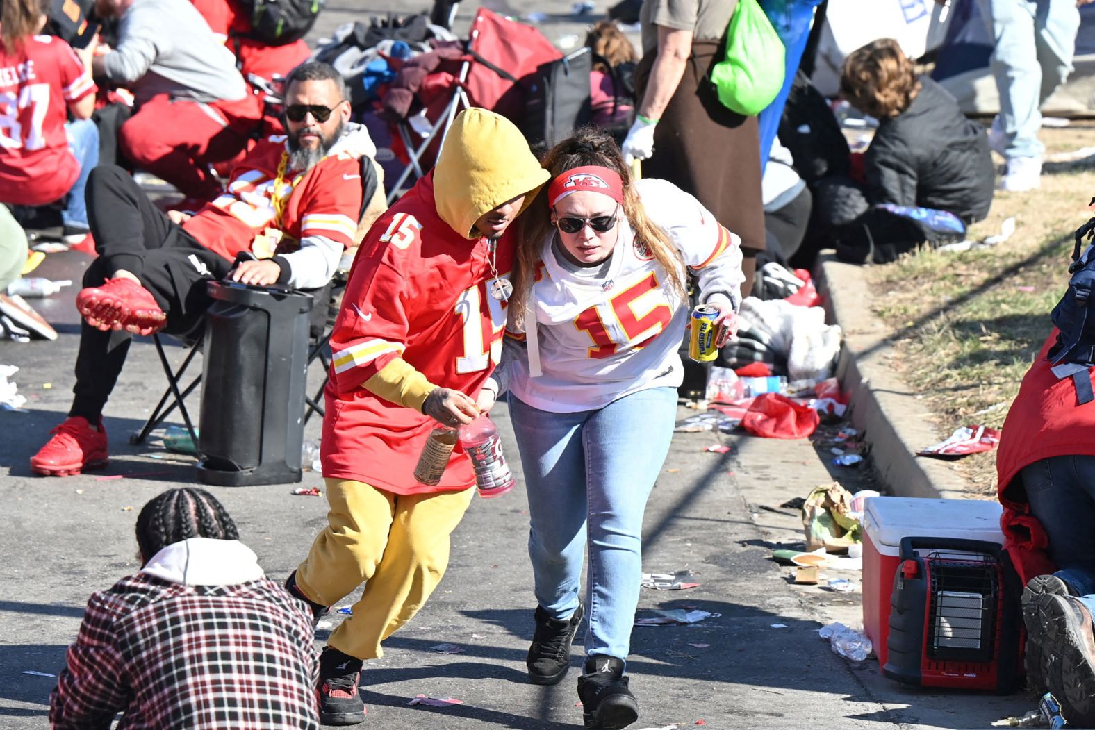 A couple of Chiefs fans leave the area after shots were fired.