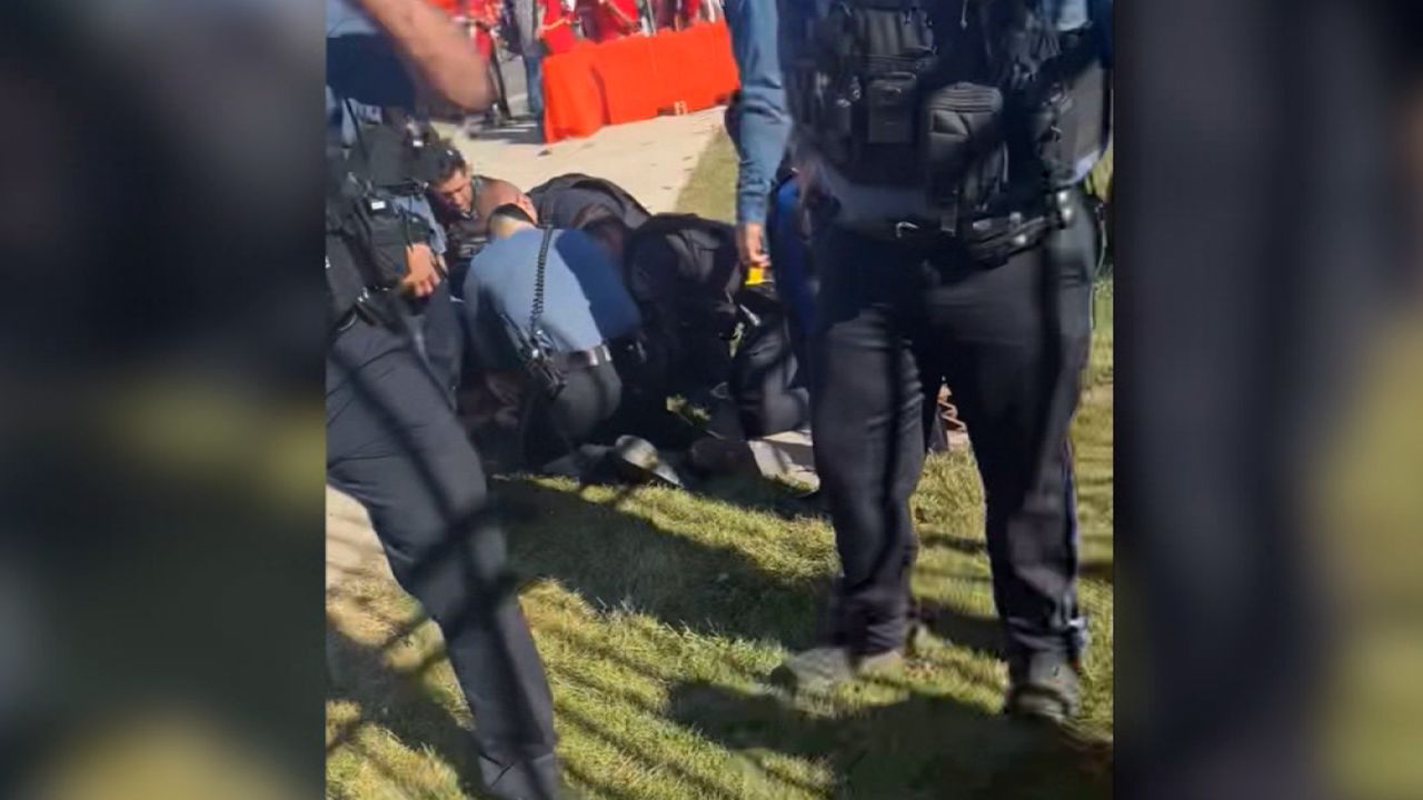 man tackles alleged gunman Kansas City parade