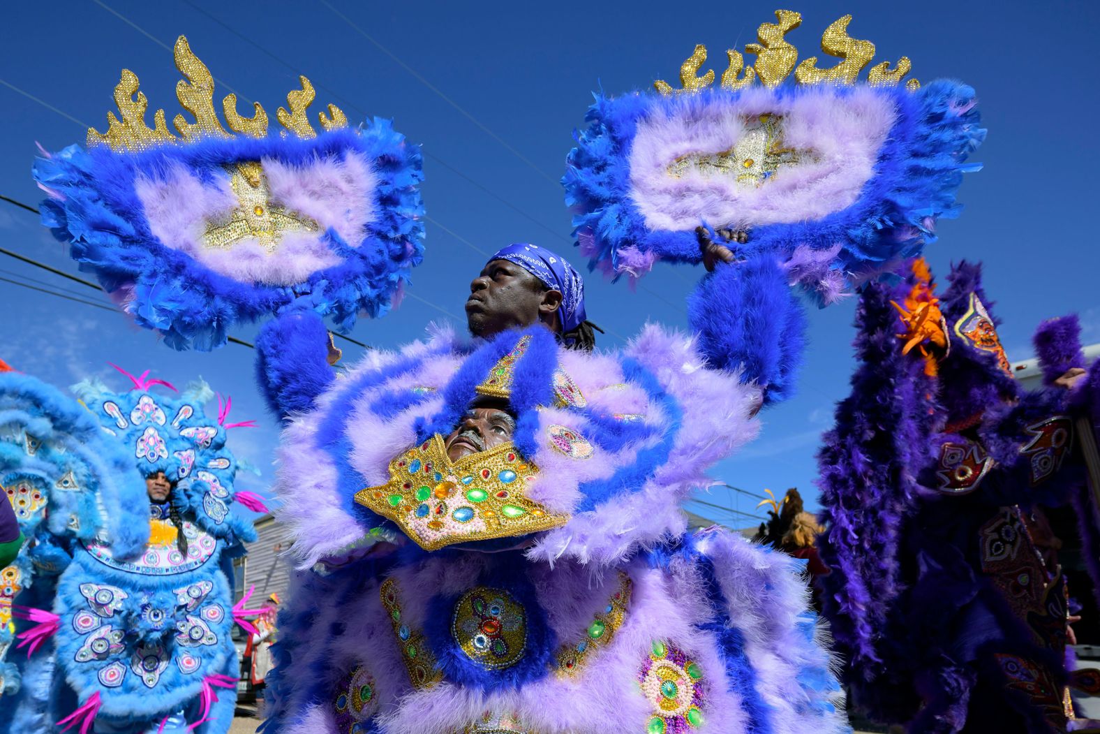 Members of the Monogram Hunters take part in a Mardi Gras parade in New Orleans on Tuesday, February 13.