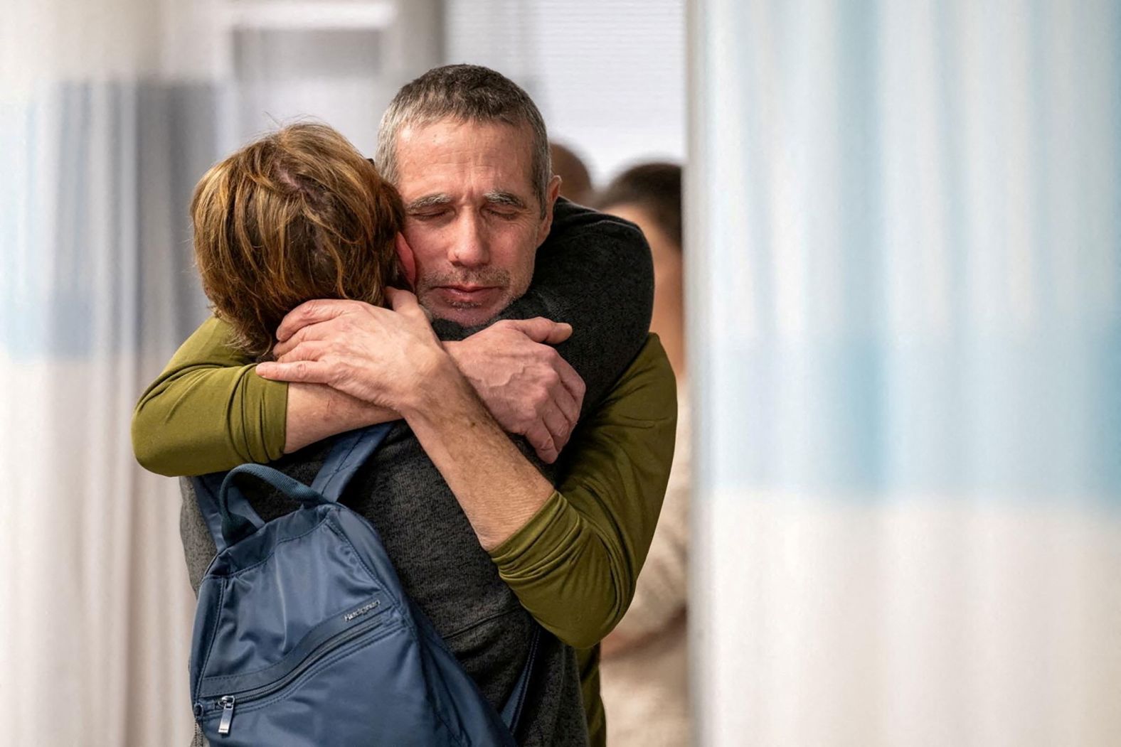 Fernando Simon Marman hugs a loved one in Ramat Gan, Israel, on Monday, February 12, after <a href="index.php?page=&url=https%3A%2F%2Fwww.cnn.com%2Fmiddleeast%2Flive-news%2Fisrael-hamas-war-gaza-news-02-12-24%2Fh_85d3d92d4175d949aff8816b661e6dff" target="_blank">he and another hostage were rescued</a> in an Israeli military raid in Rafah, Gaza. Marman, 60, and Louis Har, 70, were both taken during Hamas' October 7 attack on Israel. After the rescue, <a href="index.php?page=&url=https%3A%2F%2Fwww.cnn.com%2F2024%2F02%2F14%2Fmiddleeast%2Frafah-international-opposition-israel-ground-offensive-intl-hnk%2Findex.html" target="_blank">the total number of hostages left in Gaza was 134</a>, according to Israel Defense Forces spokesperson Daniel Hagari.