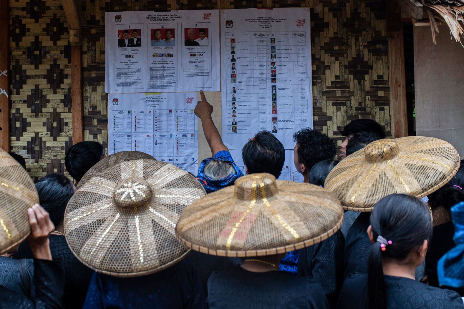 Members of the indigenous Baduy tribe check the candidates list in the Indonesian village of Kanekes before casting their ballot during <a href="index.php?page=&url=https%3A%2F%2Fwww.cnn.com%2F2024%2F02%2F14%2Fasia%2Findonesia-election-prabowo-subianto-intl-hnk%2Findex.html" target="_blank">Indonesia's presidential and legislative elections</a> on Wednesday, February 14.