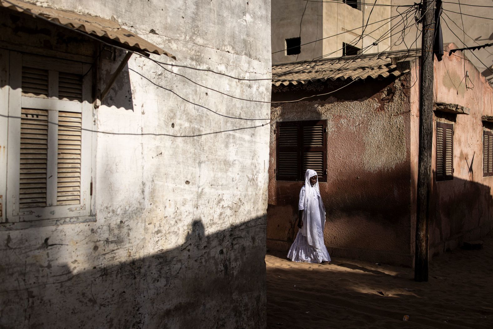 A woman walks down a road in Dakar, Senegal, on Sunday, February 11. <a href="index.php?page=&url=https%3A%2F%2Fwww.cnn.com%2F2024%2F02%2F08%2Fworld%2Fgallery%2Fphotos-this-week-february-1-february-8%2Findex.html" target="_blank">See last week in 32 photos</a>.