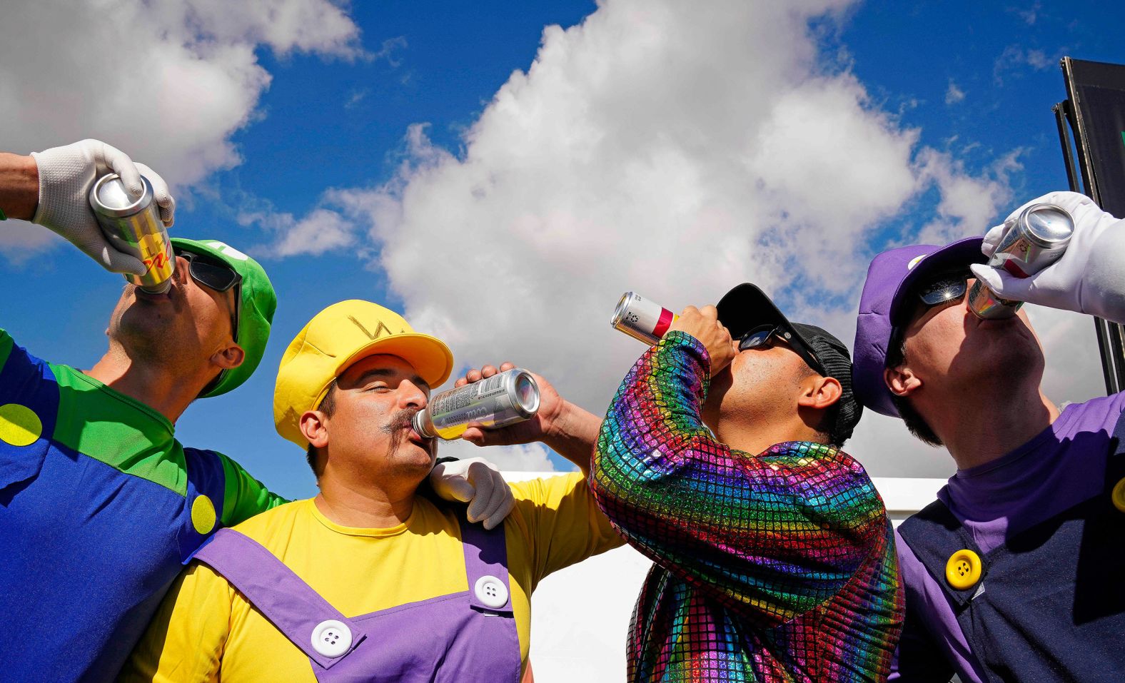 Costumed golf fans — from left, Grant Collinson, Cody Zavala, Juan Ruiz and Brett Beehler — drink beers while attending the <a href="index.php?page=&url=https%3A%2F%2Fwww.cnn.com%2F2024%2F02%2F12%2Fsport%2Fnick-taylor-phoenix-open-crowd-trouble-spt-intl%2Findex.html" target="_blank">WM Phoenix Open</a> on Saturday, February 10. The tournament is renowned for its raucous atmosphere, but there were <a href="index.php?page=&url=https%3A%2F%2Fwww.golfdigest.com%2Fstory%2Fphoenix-open-incidents-2024" target="_blank" target="_blank">various crowd-related incidents this week</a> that included arrests, fights and clashes between golfers and fans.