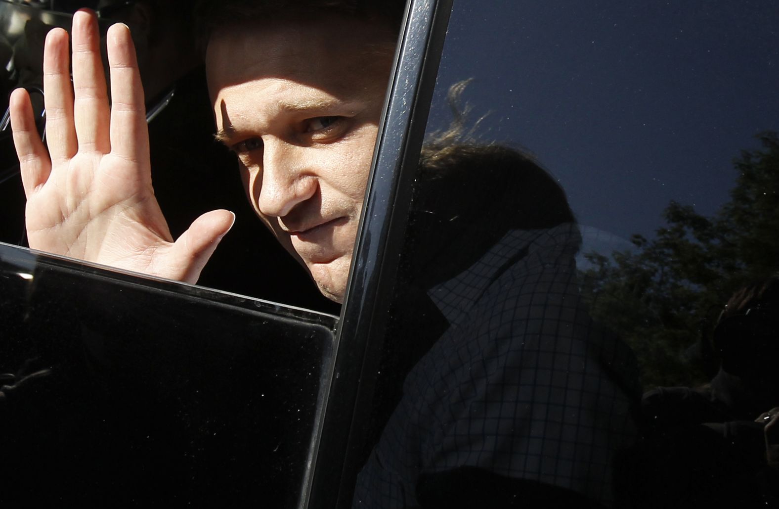Navalny greets supporters from inside a car after he was released from a police station in Moscow in May 2012. He received a 15-day sentence for disobeying police during a rally.