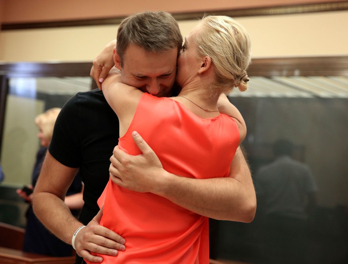 Russian opposition leader Alexei Navalny, embraces his wife Yulia, as he was released in a courtroom in Kirov, Russia on Friday, July 19, 2013.A Russian court on Friday released opposition leader Alexei Navalny from custody less than 24 hours after he was convicted of embezzlement and sentenced to five years in prison.The release came after a surprise request by prosecutors, who said that because Navalny is a candidate in this fall's Moscow mayoral race keeping him in custody would deny him his right to seek election. (AP Photo/Evgeny Feldman)