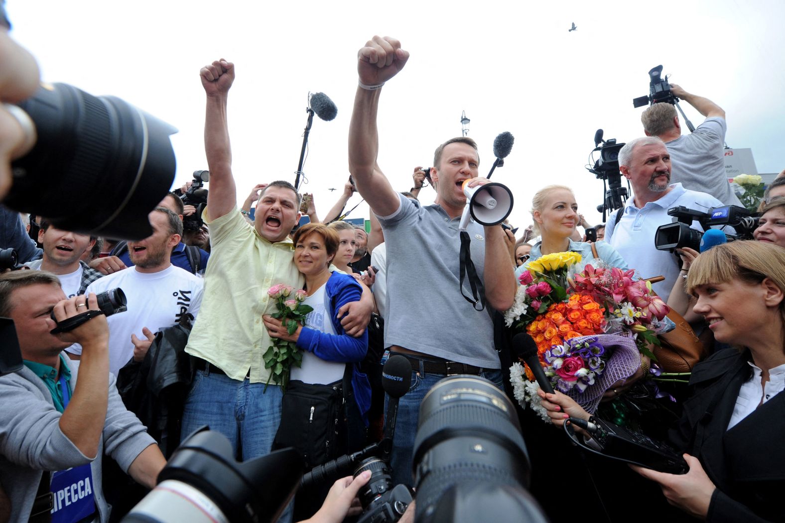 Navalny and Ofitserov, center left, address supporters at a railway station in Moscow in July 2013. Navalny said he would push ahead with his bid to become mayor of Moscow. He finished second in the race.