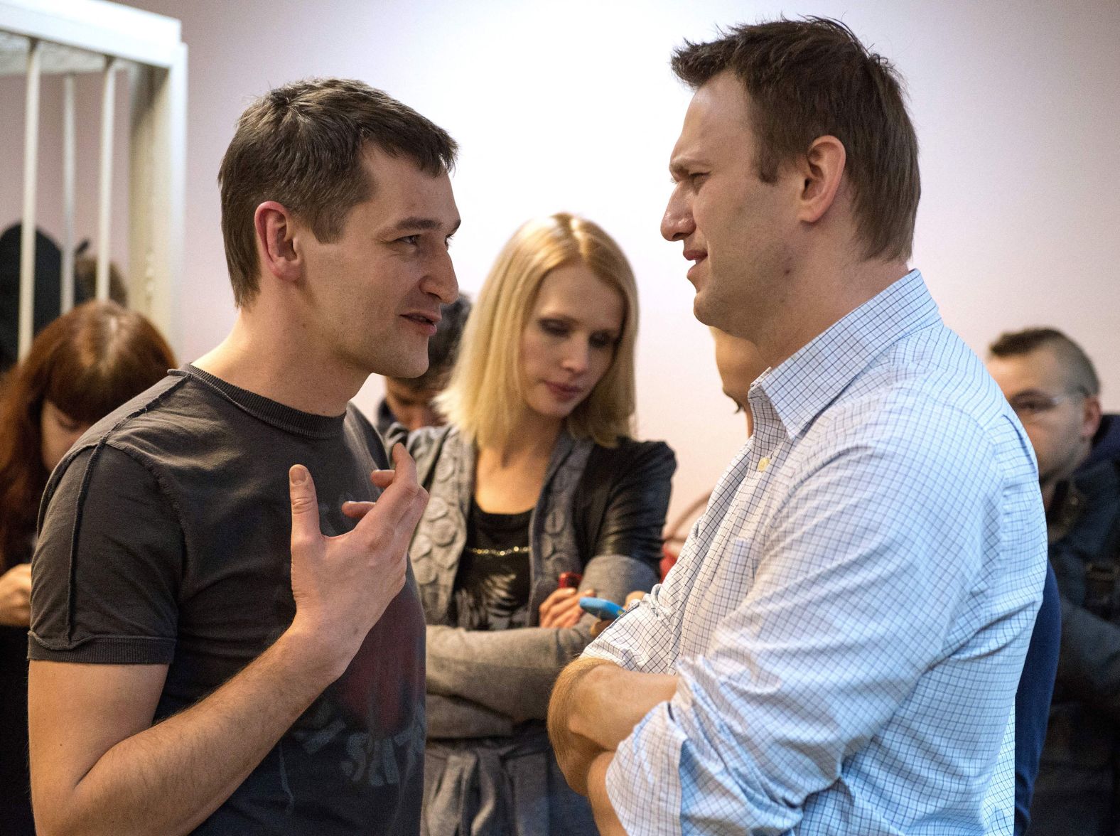 Navalny speaks to his brother and co-defendant, Oleg, as they attend the verdict announcement of their fraud trial at a court in Moscow in 2014. The Navalnys were accused of defrauding the Russian subsidiary of the French cosmetics company Yves Rocher. Alexey received a suspended sentence of three and a half years. Oleg was sentenced to three and a half years in prison and handcuffed in the courtroom. Alexey denounced it as political pressure and said he believed the conviction was politically motivated.