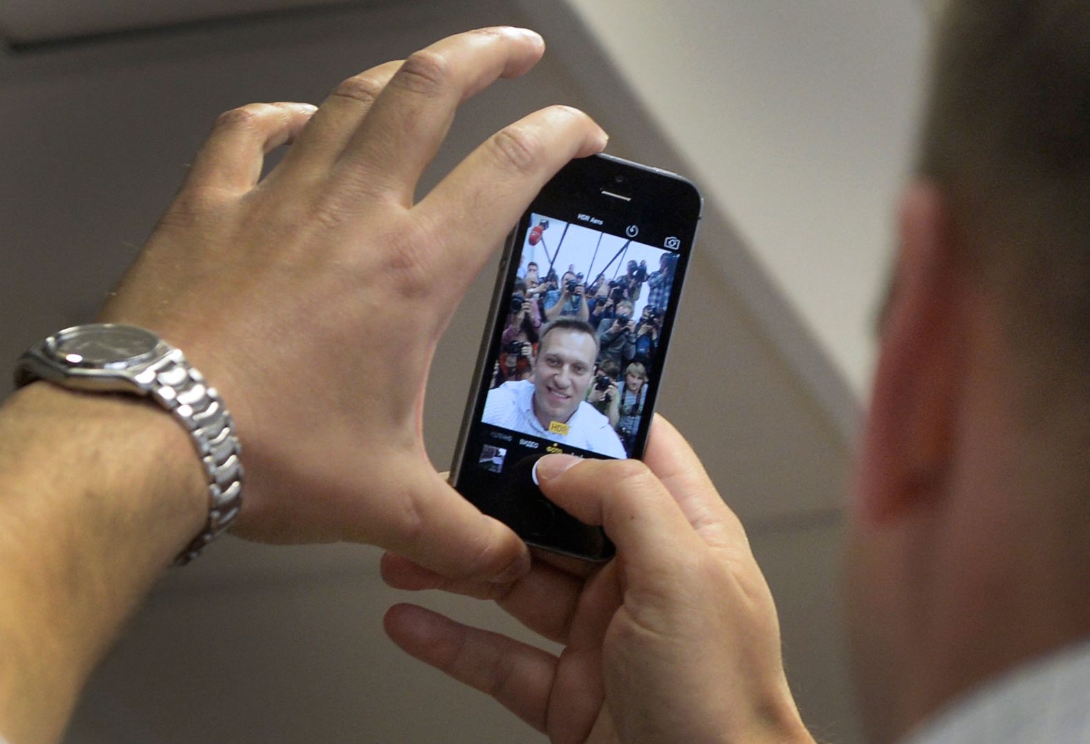 Navalny takes a selfie with the media during an appeal hearing in Moscow in May 2015.