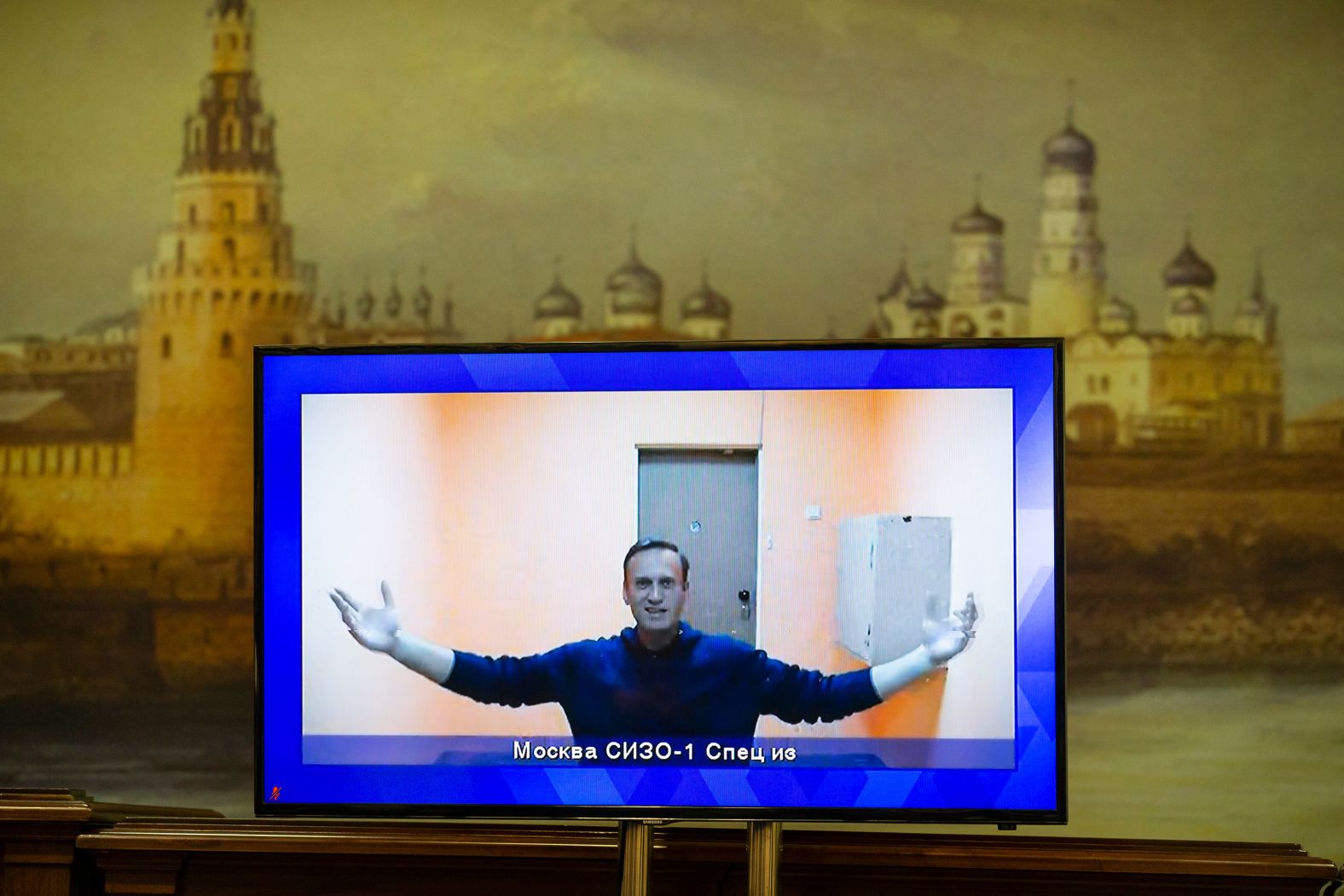 Navalny appears on a TV screen during a court hearing of his appeal in Moscow in January 2021. A Moscow court sentenced Navalny to prison for more than two and a half years for violating probation terms while he was in Germany.