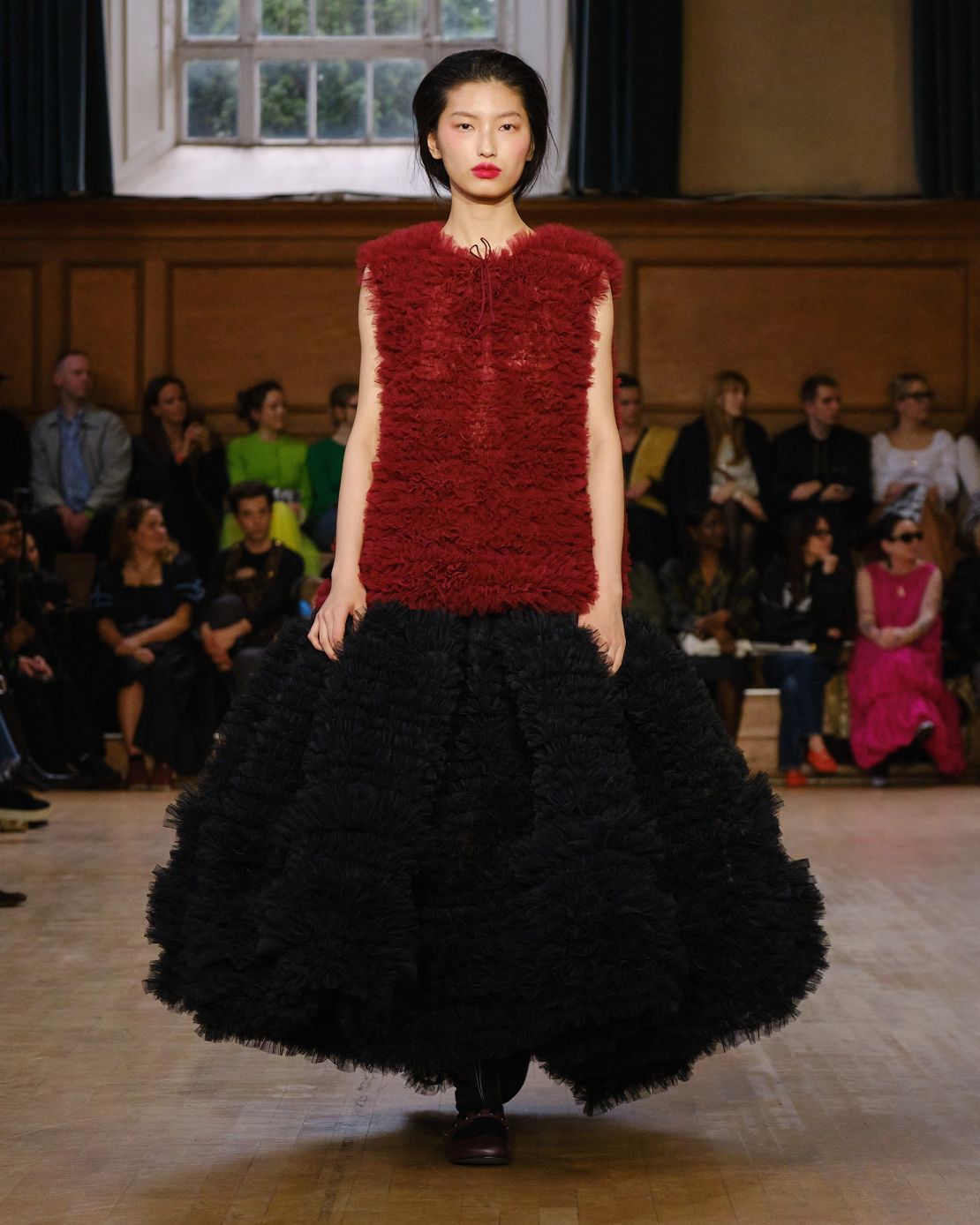 Molly Goddard's frilly, feminine creations were given a new edge in moodier colors like maroon and black.