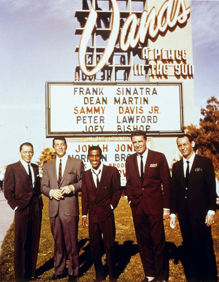 The famous group of entertainers known as the Rat Pack — from left, Sinatra, Dean Martin, Sammy Davis Jr., Peter Lawford and Joey Bishop — pose outside the Sands casino in 1960.