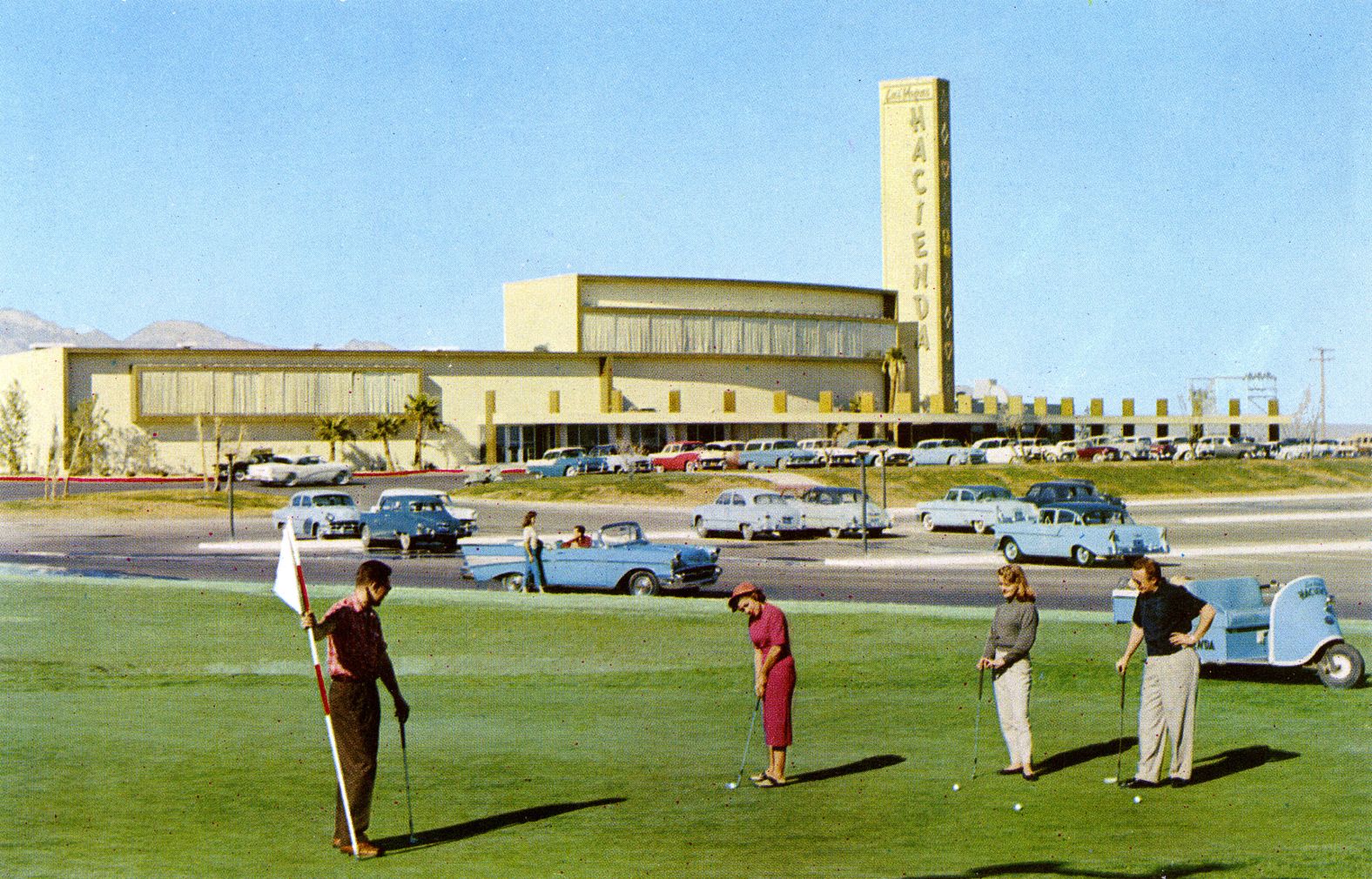 People play in front of the Hacienda Hotel circa 1960.