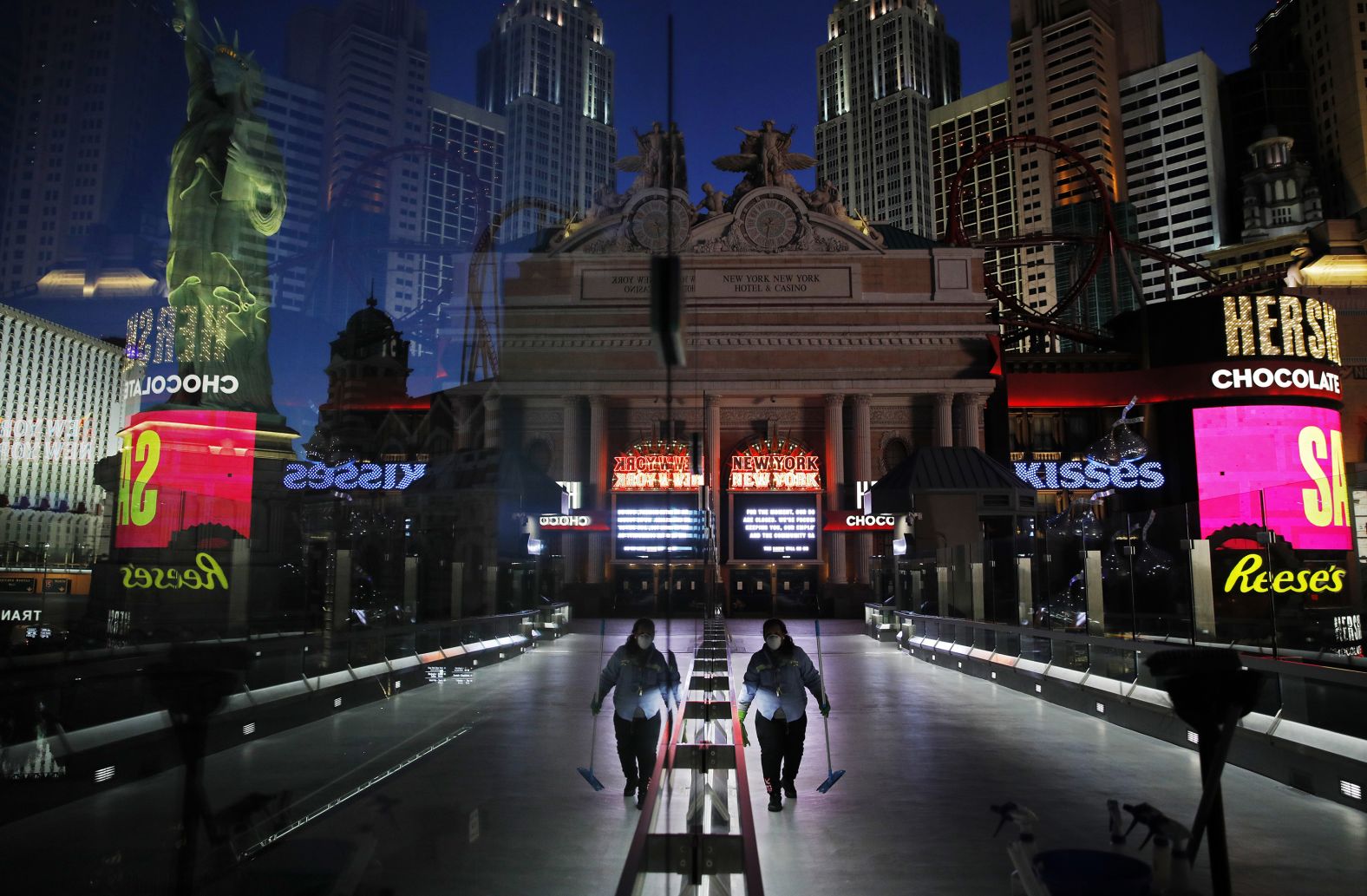 A worker cleans a pedestrian walkway, which was devoid of the usual crowds because of the Covid-19 pandemic in 2020.