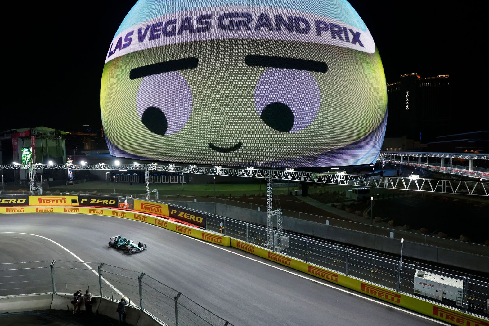 Lance Stroll drives by the Sphere in Las Vegas during a Formula One practice session in 2023. The new race took drivers through the Las Vegas Strip and other streets in the city.