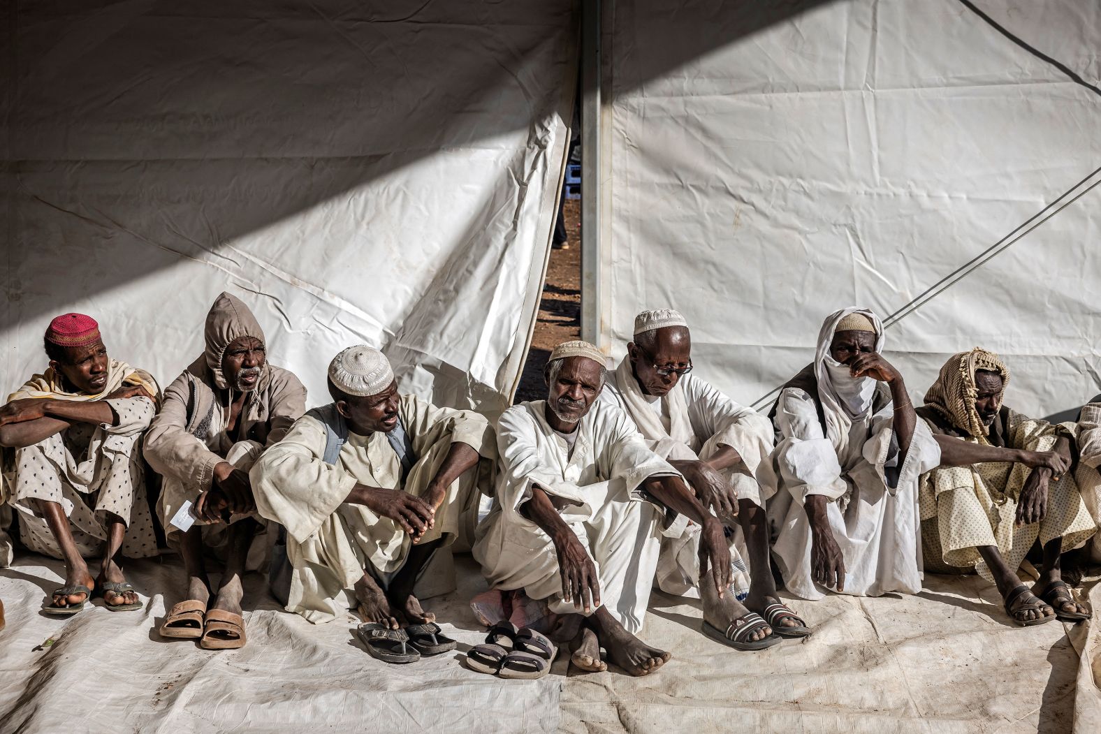 Men who have fled from <a href="index.php?page=&url=https%3A%2F%2Fwww.cnn.com%2F2024%2F02%2F08%2Fafrica%2Fun-appeal-for-usd4-1-billion-amidst-epic-suffering-in-sudan-intl%2Findex.html" target="_blank">the war in Sudan</a> line up for a cash assistance program in Renk, South Sudan, on Thursday, February 15.