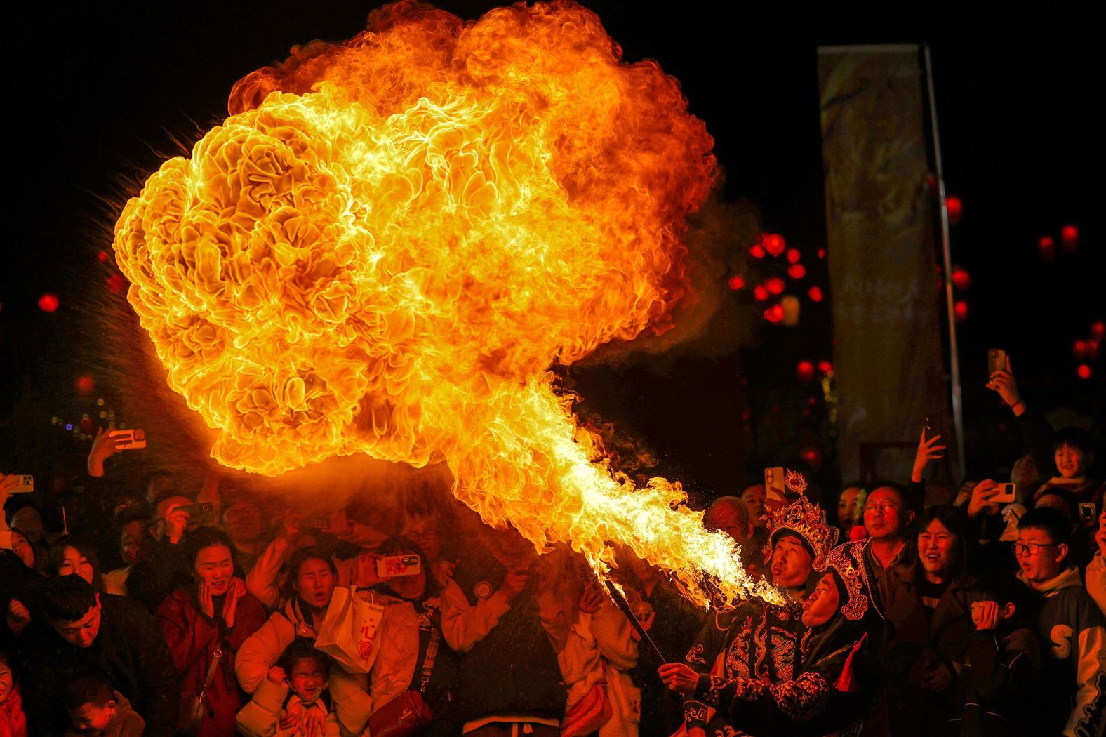 A folk artist blows fire from his mouth during <a href="index.php?page=&url=http%3A%2F%2Fwww.cnn.com%2F2024%2F02%2F08%2Fworld%2Fgallery%2Flunar-new-year-2024%2Findex.html" target="_blank">Lunar New Year celebrations</a> in Luoyang, China, on Saturday, February 17.