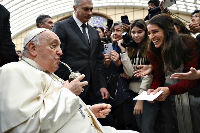 The Pope drinks mate offered by Argentinian pilgrims who were visiting the Vatican in January 2024.