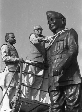 Modi and BJP founder Lal Krishna Advani place a garland around a statue of Indian nationalist Subhas Chandra Bose, in Ahmedabad, India on January 23, 1992.