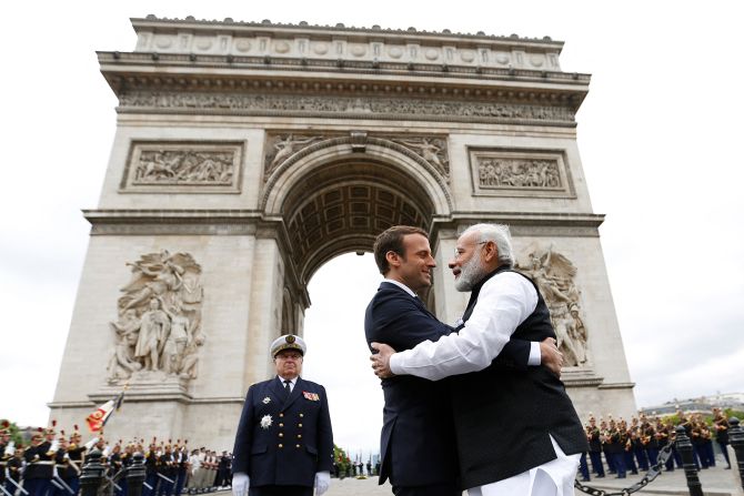 Modi hugs French President Emmanuel Macron after a ceremony at the Arc de Triomphe in Paris, on June 3, 2017. 
