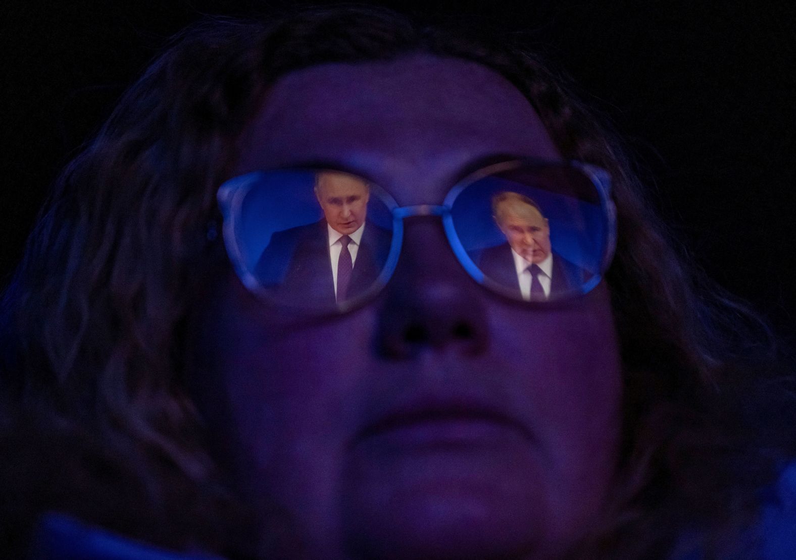 A woman at a cinema in St. Petersburg, Russia, watches a broadcast of Russian President Vladimir Putin's <a href="index.php?page=&url=https%3A%2F%2Fwww.cnn.com%2F2024%2F02%2F29%2Feurope%2Fputin-nuclear-war-state-of-nation-russia-ukraine-intl%2Findex.html" target="_blank">annual state of the nation address</a> on Thursday, February 29. In his speech, Putin warned the West of the risk of nuclear war if they send their own troops to fight for Ukraine, saying Moscow had the weapons to strike Western targets.