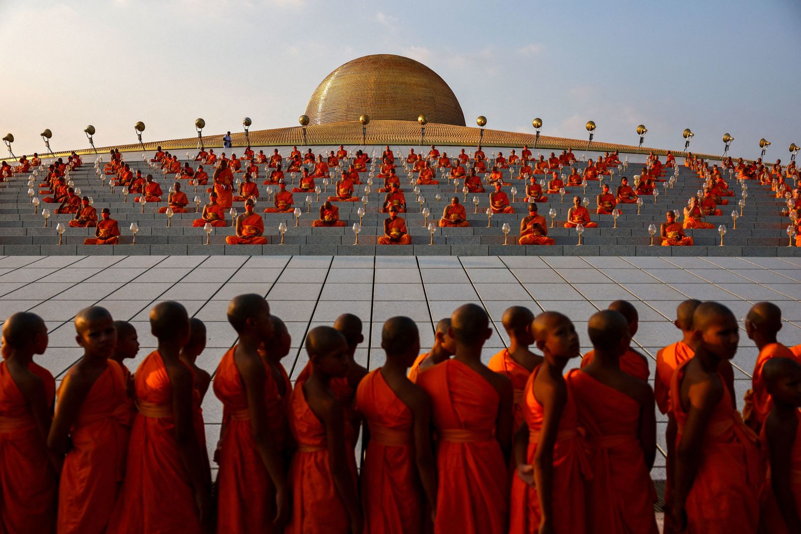 Buddhist monks pray at the Wat Phra Dhammakaya, in Thailand's Pathum Thani province, during a ceremony commemorating Makha Bucha Day on Saturday, February 24.