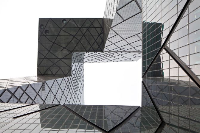 The extreme 75-meter cantilever of the CCTV Headquarters stood out during its construction between 2004-2012 https://www.oma.com/projects/cctv-headquarters and remains a defining work of deconstructivist architecture today.