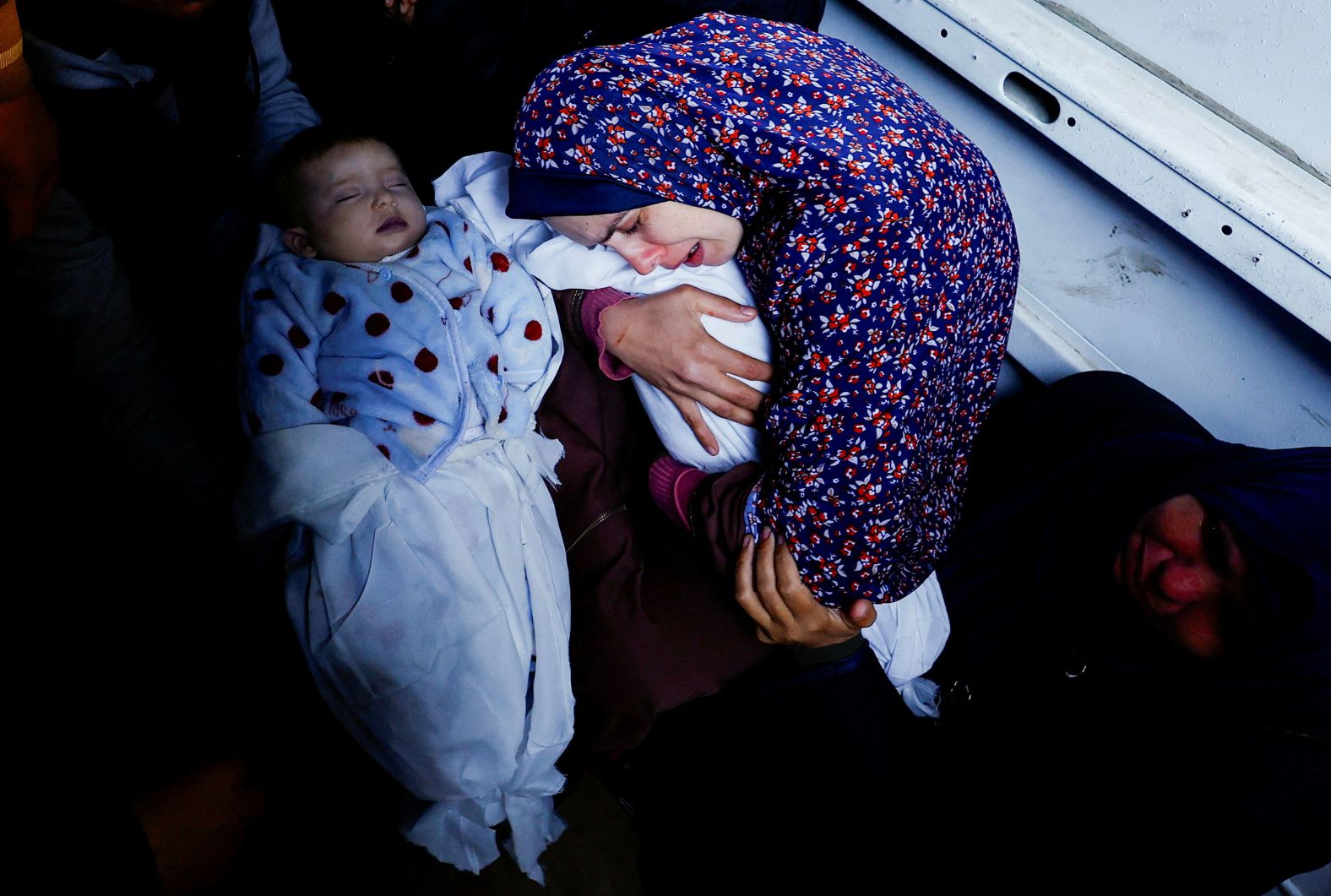 Rania Abu Anza holds one of her 5-month-old twins who were killed when an Israeli strike hit their house in Rafah, Gaza, on Sunday, March 3. Abu Anza's husband and at least 11 other relatives were killed when the house collapsed. "I screamed for my children and my husband," she said, <a href="index.php?page=&url=https%3A%2F%2Fapnews.com%2Farticle%2Fisrael-hamas-war-children-twins-killed-gaza-25282b273b92aec7fc75c3212f8d8e3f" target="_blank" target="_blank">according to the Associated Press</a>. "They were all dead. Their father took them and left me behind." It took Abu Anza and her husband 10 years and three rounds of in vitro fertilization to become pregnant.