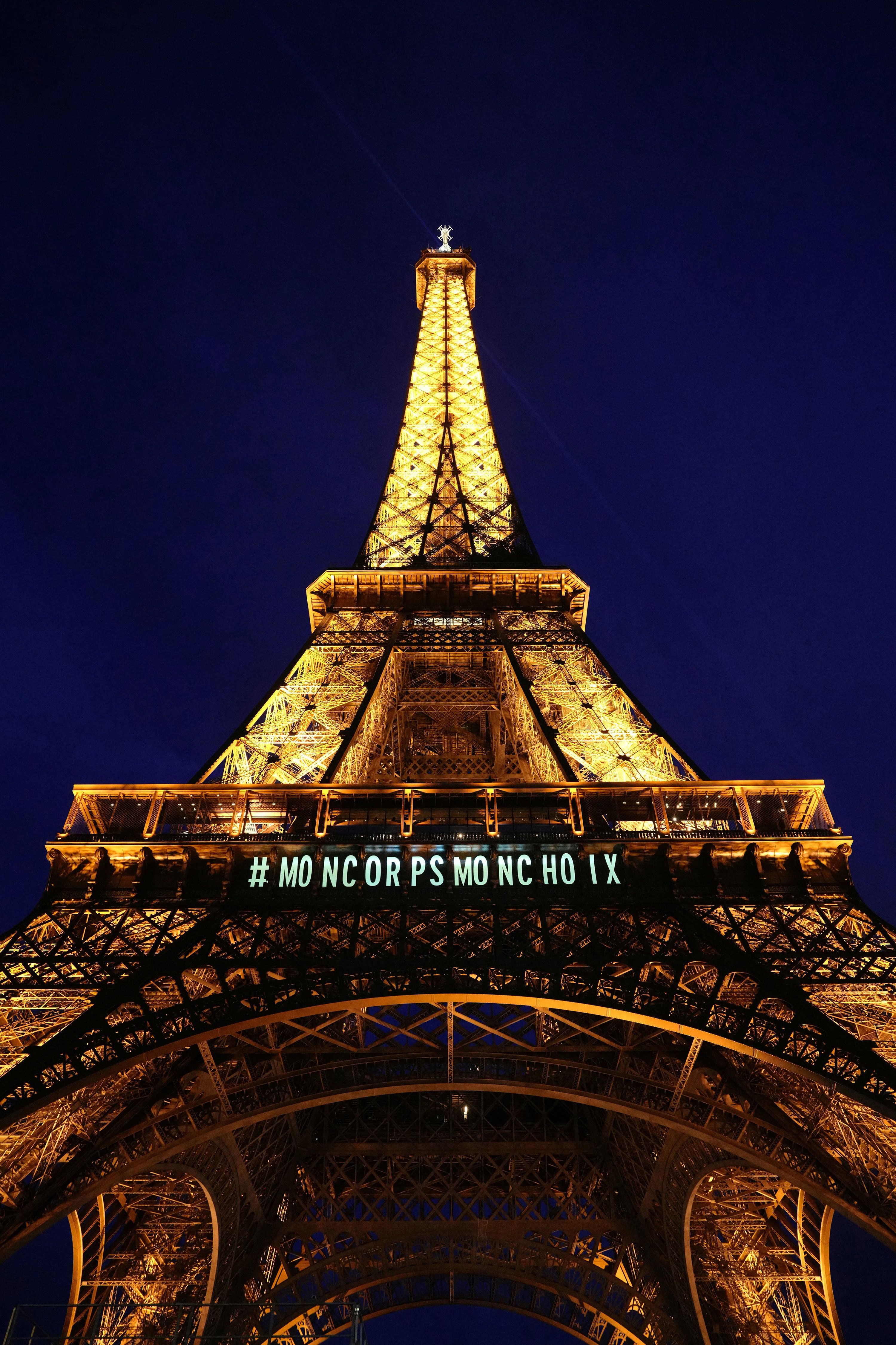 A message reading "my body my choice" is projected onto the Eiffel Tower in Paris on Monday, March 4.