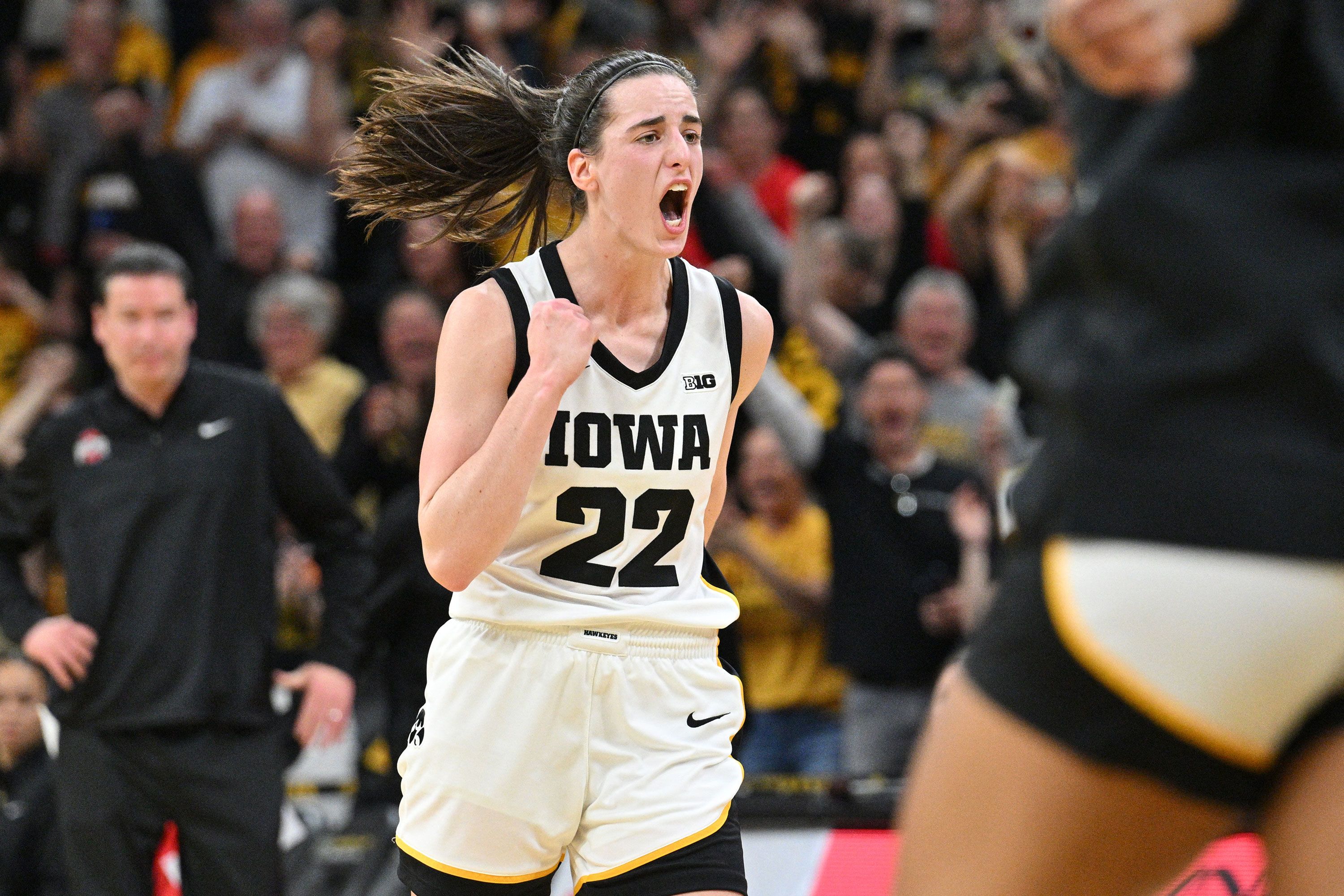 Iowa basketball star Caitlin Clark reacts Sunday, March 3, after she passed "Pistol" Pete Maravich to became the all-time leading scorer in NCAA Division I basketball.