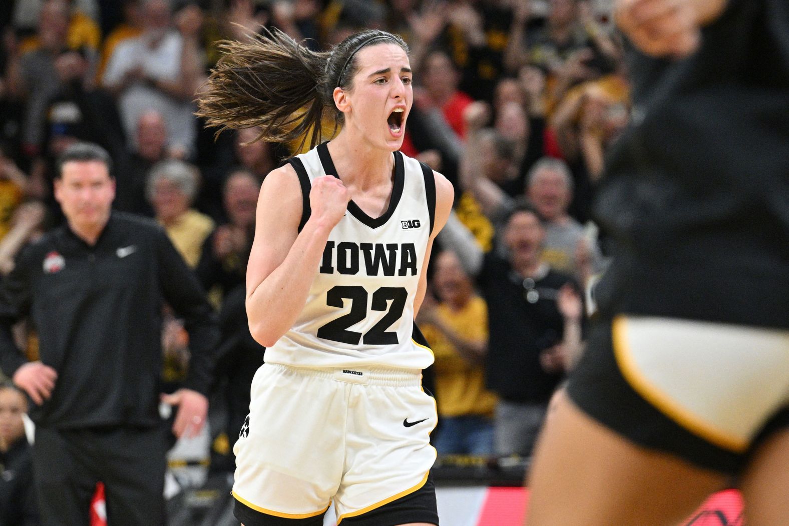 Iowa basketball star Caitlin Clark reacts Sunday, March 3, after she passed "Pistol" Pete Maravich to became the <a href="index.php?page=&url=https%3A%2F%2Fwww.cnn.com%2F2024%2F03%2F03%2Fsport%2Fcaitlin-clark-record-ncaa-basketball-scorer-spt%2Findex.html" target="_blank">all-time leading scorer</a> in NCAA Division I basketball — male or female.
