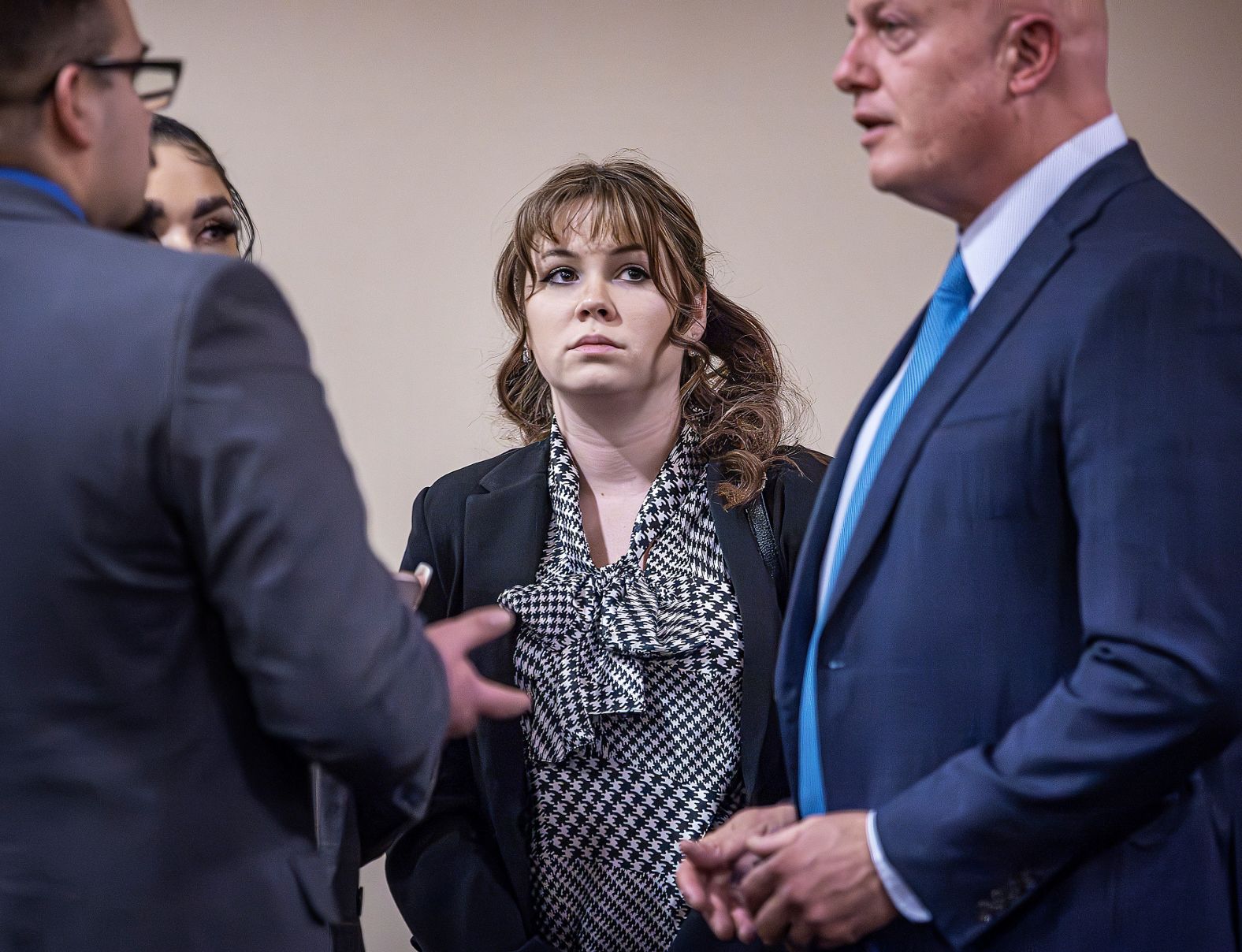 Hannah Gutierrez Reed, the "Rust" film armorer, talks with attorney Jason Bowles, right, and her defense team during a trial in Santa Fe, New Mexico, on Tuesday, March 5. She was <a href="index.php?page=&url=https%3A%2F%2Fwww.cnn.com%2F2024%2F03%2F06%2Fentertainment%2Frust-trial-hannah-gutierrez-reed%2Findex.html" target="_blank">found guilty of involuntary manslaughter</a> on Wednesday, stemming from the on-set fatal shooting of cinematographer Halyna Hutchins. In 2021, Hutchins was killed by a live round of ammunition fired from a prop gun that was held by actor Alec Baldwin. Gutierrez Reed was responsible for firearm safety and storage on the movie's set.