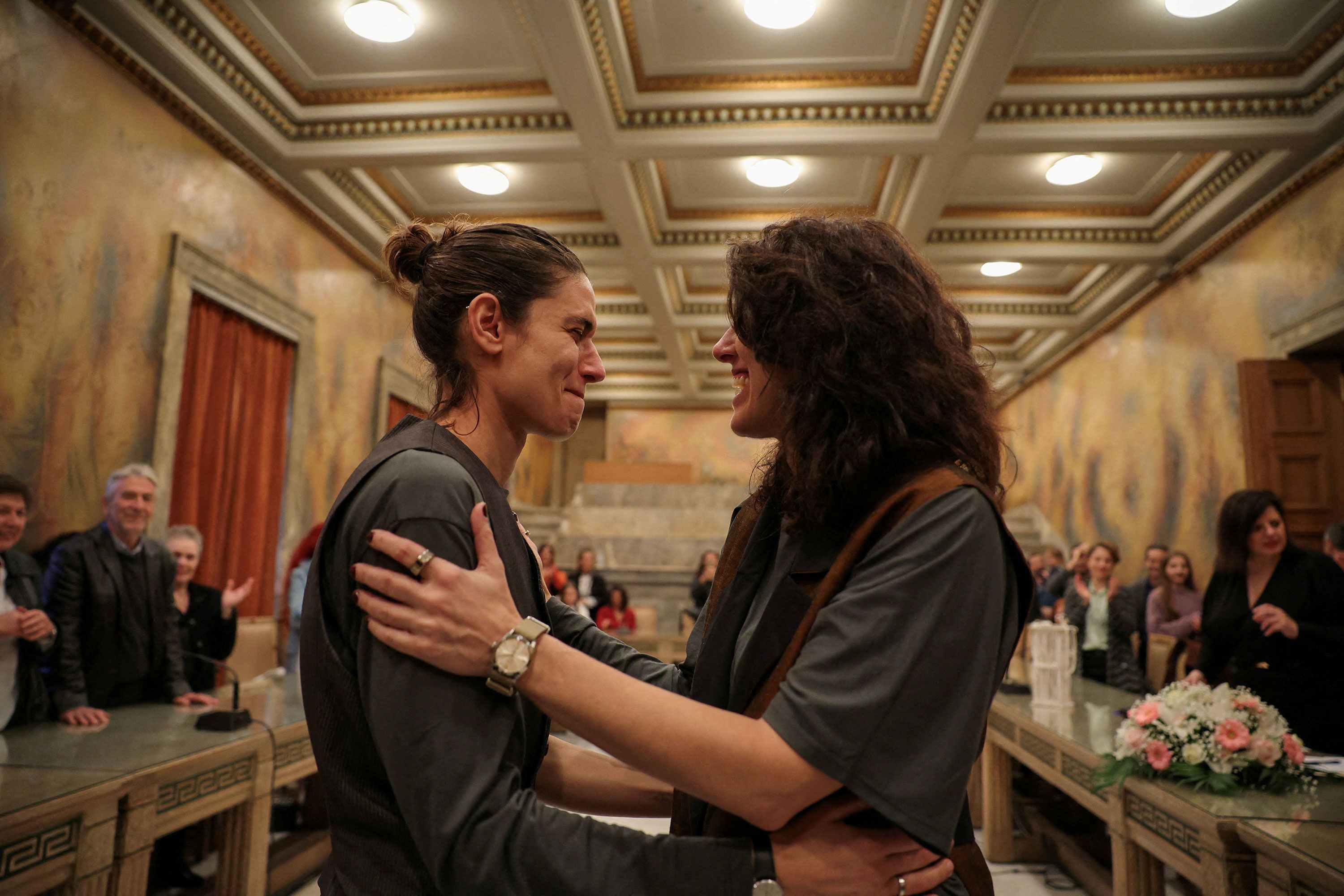 Danai Deligiorgi and Alexia Beziki embrace after their wedding ceremony at the Athens Town Hall in Athens, Greece, on Thursday, March 7.