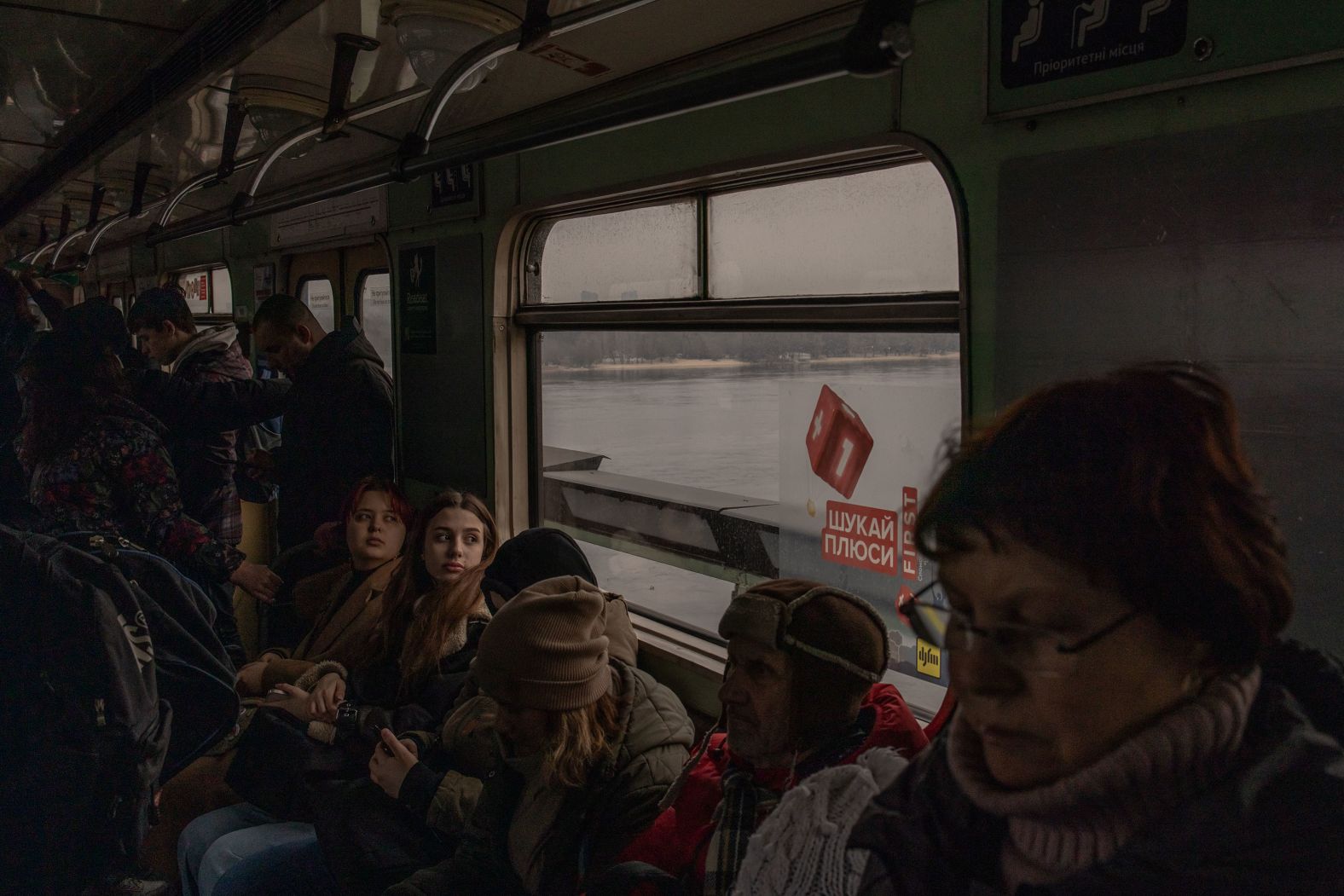 People ride on a subway in Kyiv, Ukraine, on Wednesday, March 6.