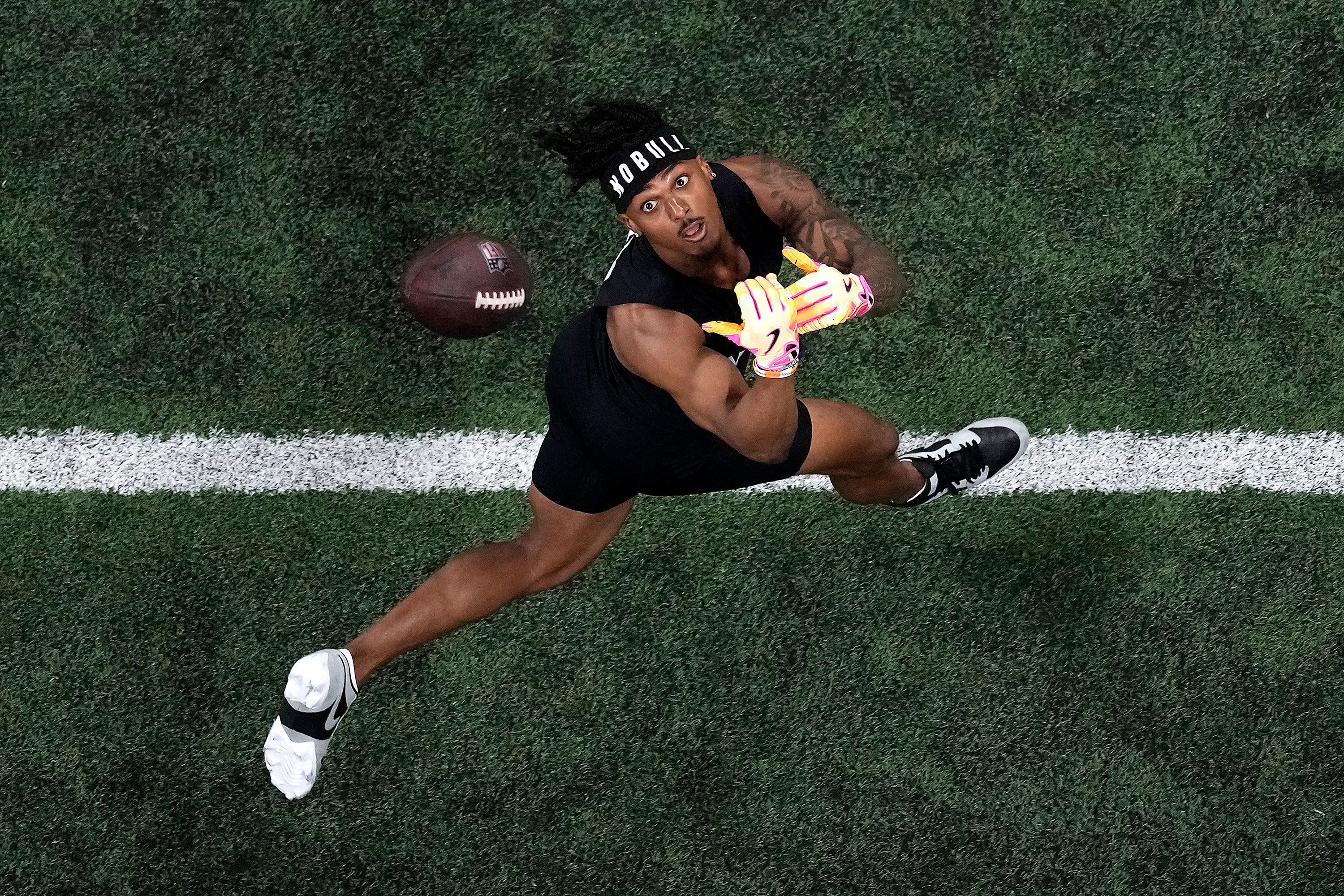 Arizona wide receiver Jacob Cowing catches a ball during the NFL's scouting combine in Indianapolis on Saturday, March 2.