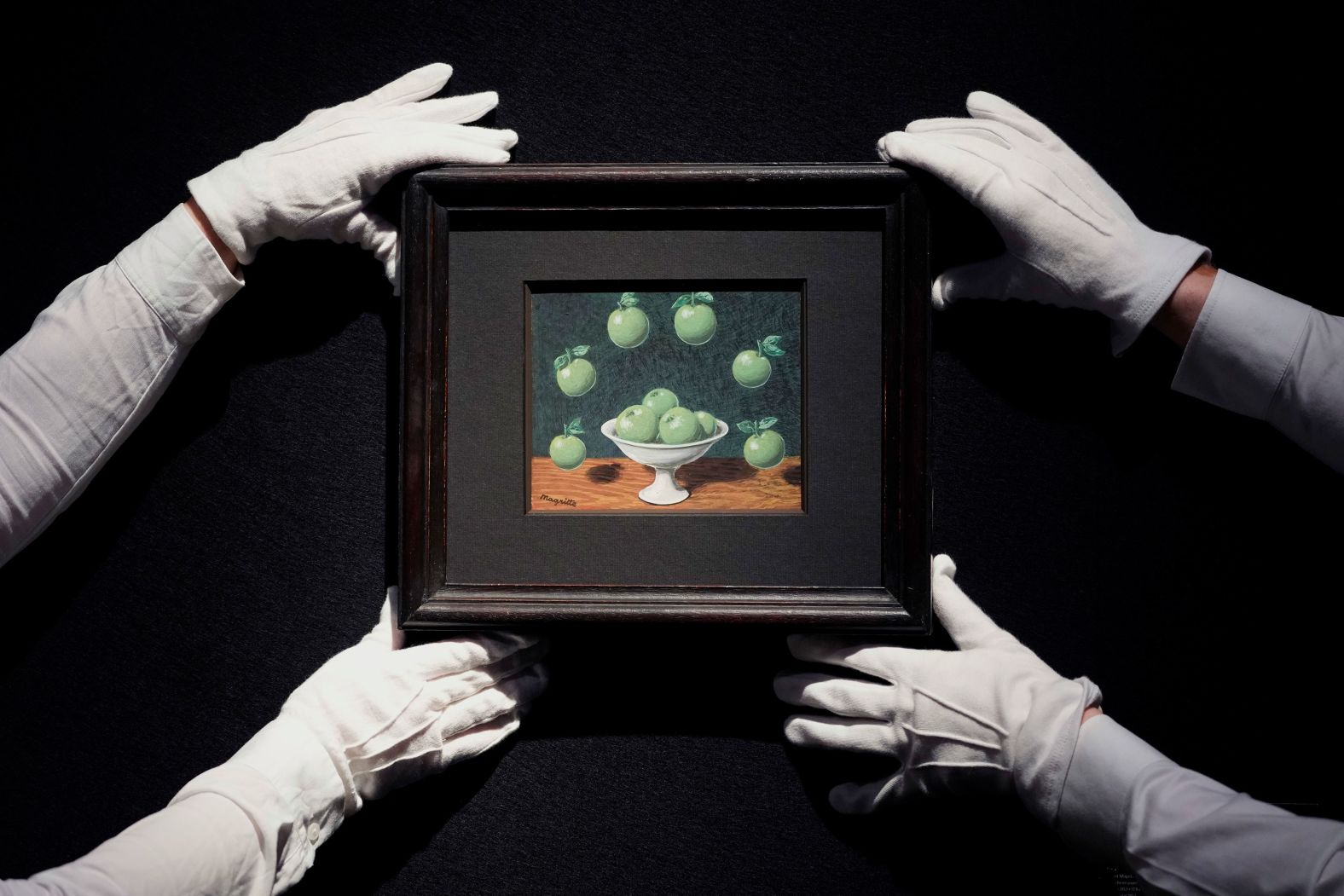 "Le principe d'Archimede," a painting by Rene Magritte, is displaced at a Christie's auction room in London on Friday, March 1. It was expected to be sold for hundreds of thousands of pounds.