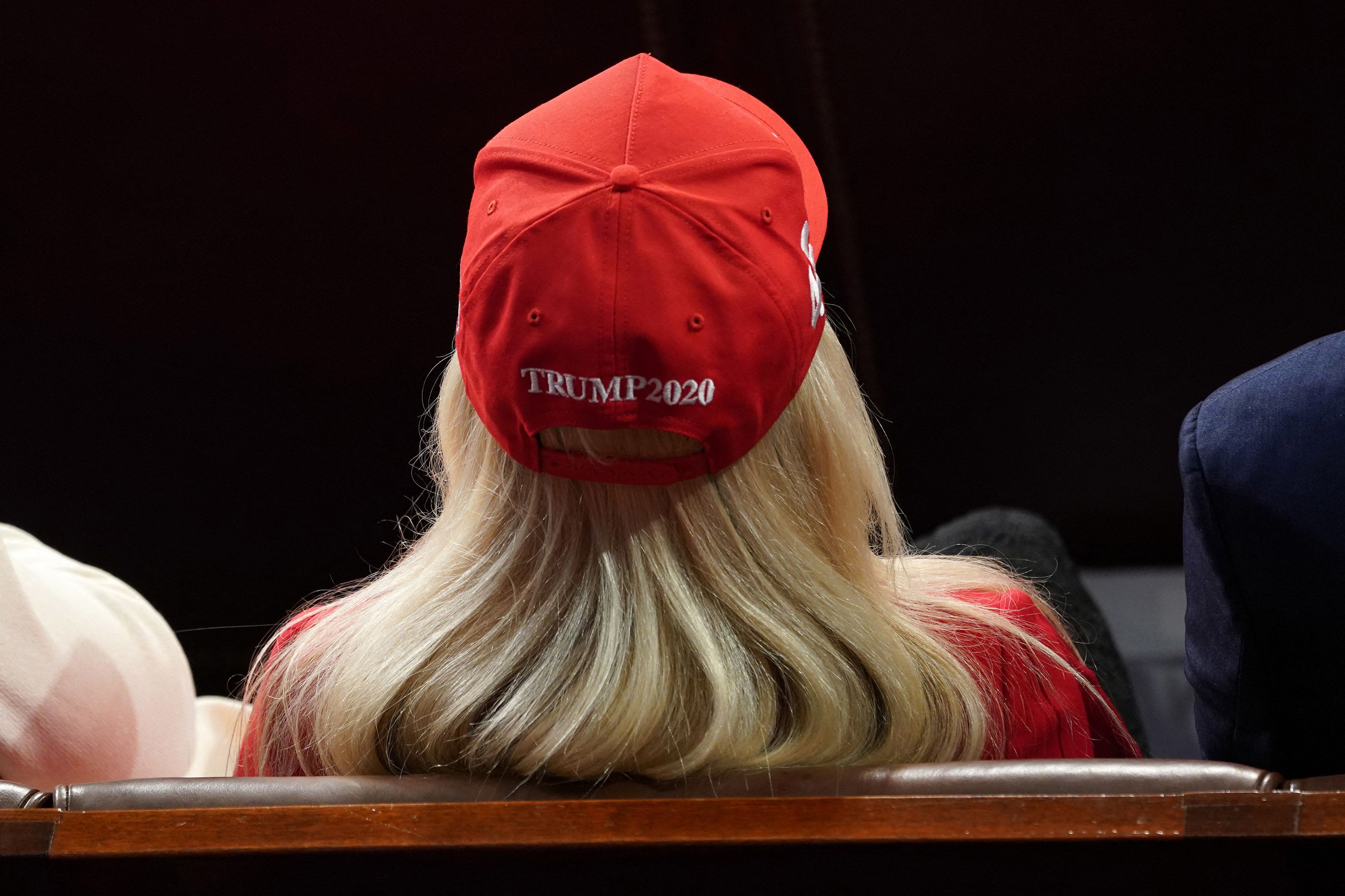 US Rep. Marjorie Taylor Greene wears a Trump 2020 hat as she watches President Biden's State of the Union address on Thursday, March 7.