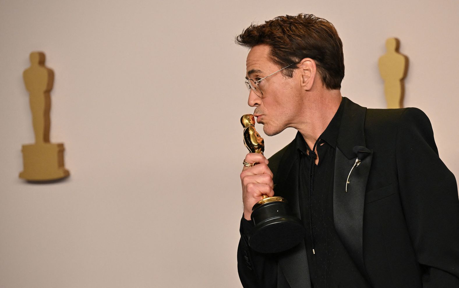 Robert Downey Jr. poses in the press room with the Oscar he won for best supporting actor. "I'd like to thank my terrible childhood and the Academy," <a href="index.php?page=&url=https%3A%2F%2Fwww.cnn.com%2Fentertainment%2Flive-news%2Foscars-academy-awards-03-10-24%2Fh_b112e2122ef918d2e30085505f824aae" target="_blank">he said in his acceptance speech</a>. "In that order."