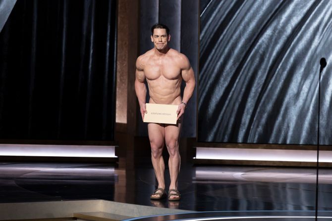 Cena presents the Oscar for best costume design. <a href="https://www.cnn.com/entertainment/live-news/oscars-academy-awards-03-10-24/h_839d82945edb96c8ca36efd588094968" target="_blank">During the bit</a>, show host Jimmy Kimmel coaxed Cena out on stage after Cena had second thoughts about streaking across stage. "Costumes are so important," Cena joked before presenting the Oscar to Waddington and "Poor Things."