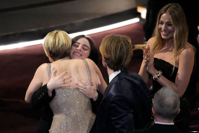 "Barbie" director Greta Gerwig, left, congratulates Billie Eilish after Eilish and her brother, Finneas, won the Oscar for best original song ("What Was I Made For?").